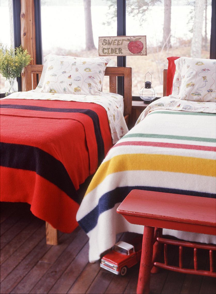 2 twin beds with colorful striped sheets and red truck San Francisco interior photographer
