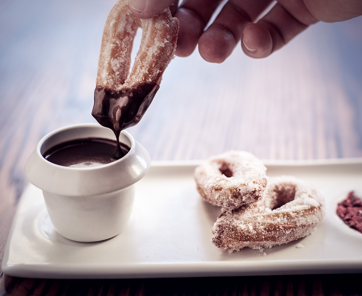 powdered sugar-covered churros in chocolate dipping sauce San Francisco food photographer