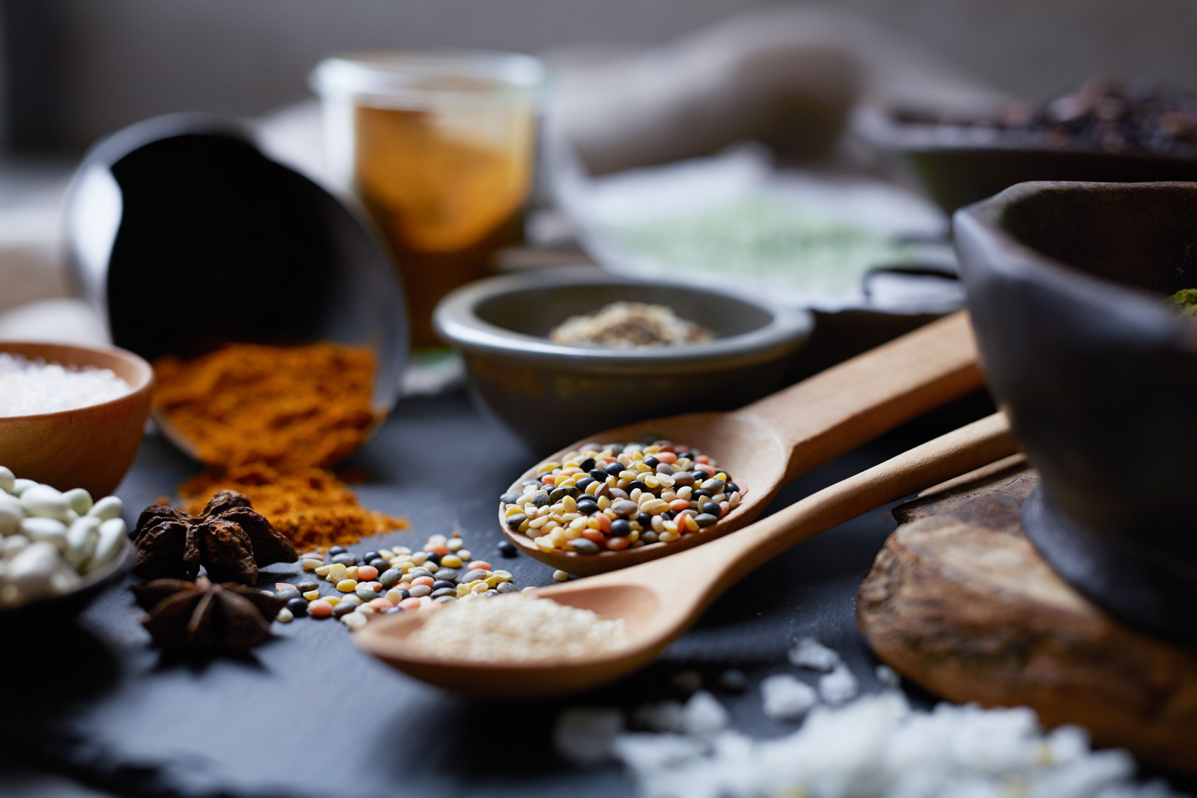 detail of seeds on a wooden spoon with spices San Francisco food photographer