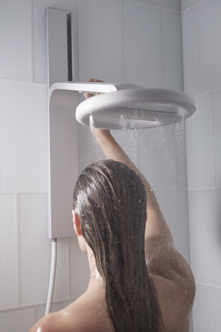 woman standing under running circular shower head San Francisco lifestyle photographer
