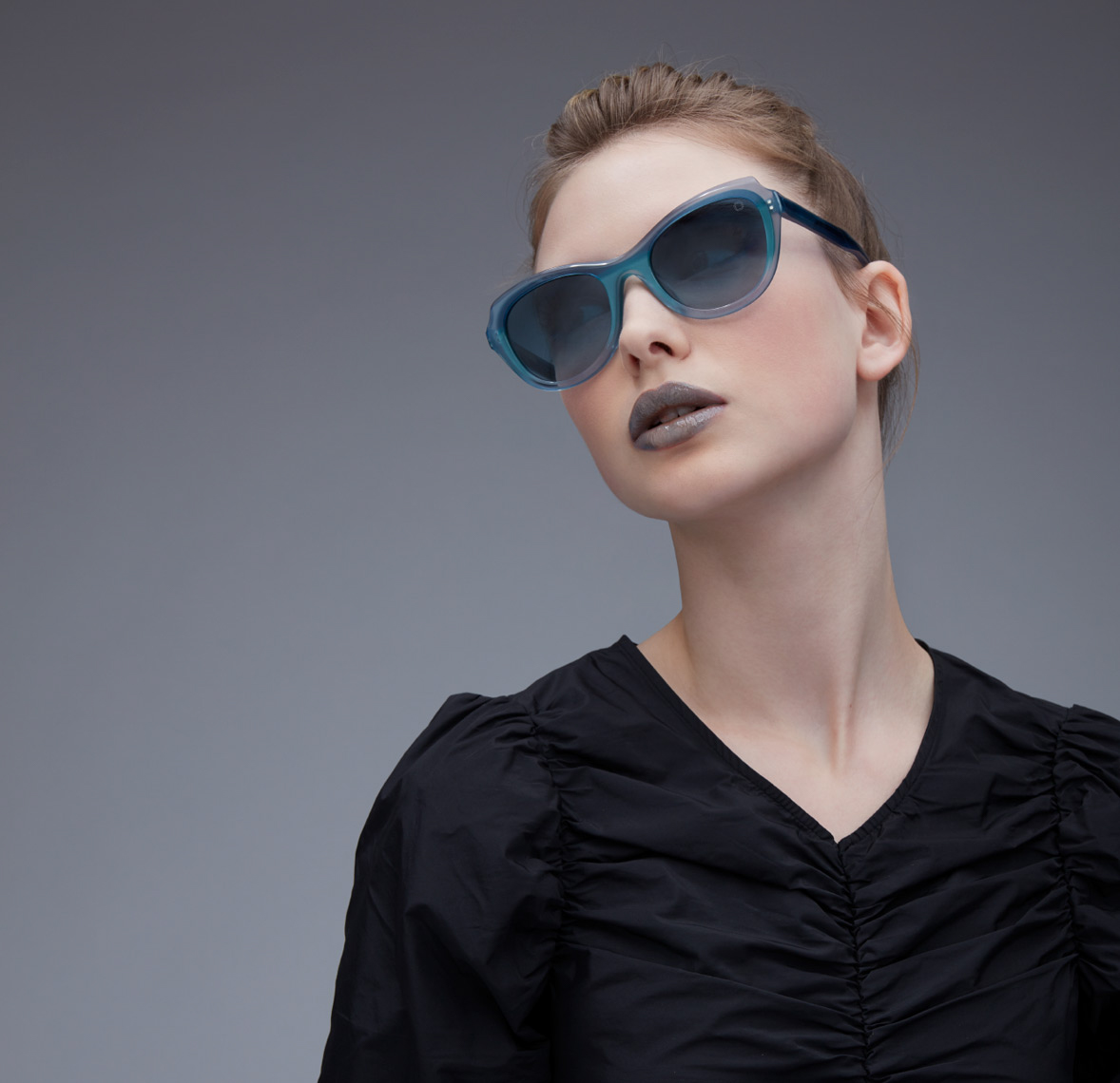 woman with grey lipstick and glasses with blue frames San Francisco fashion photographer