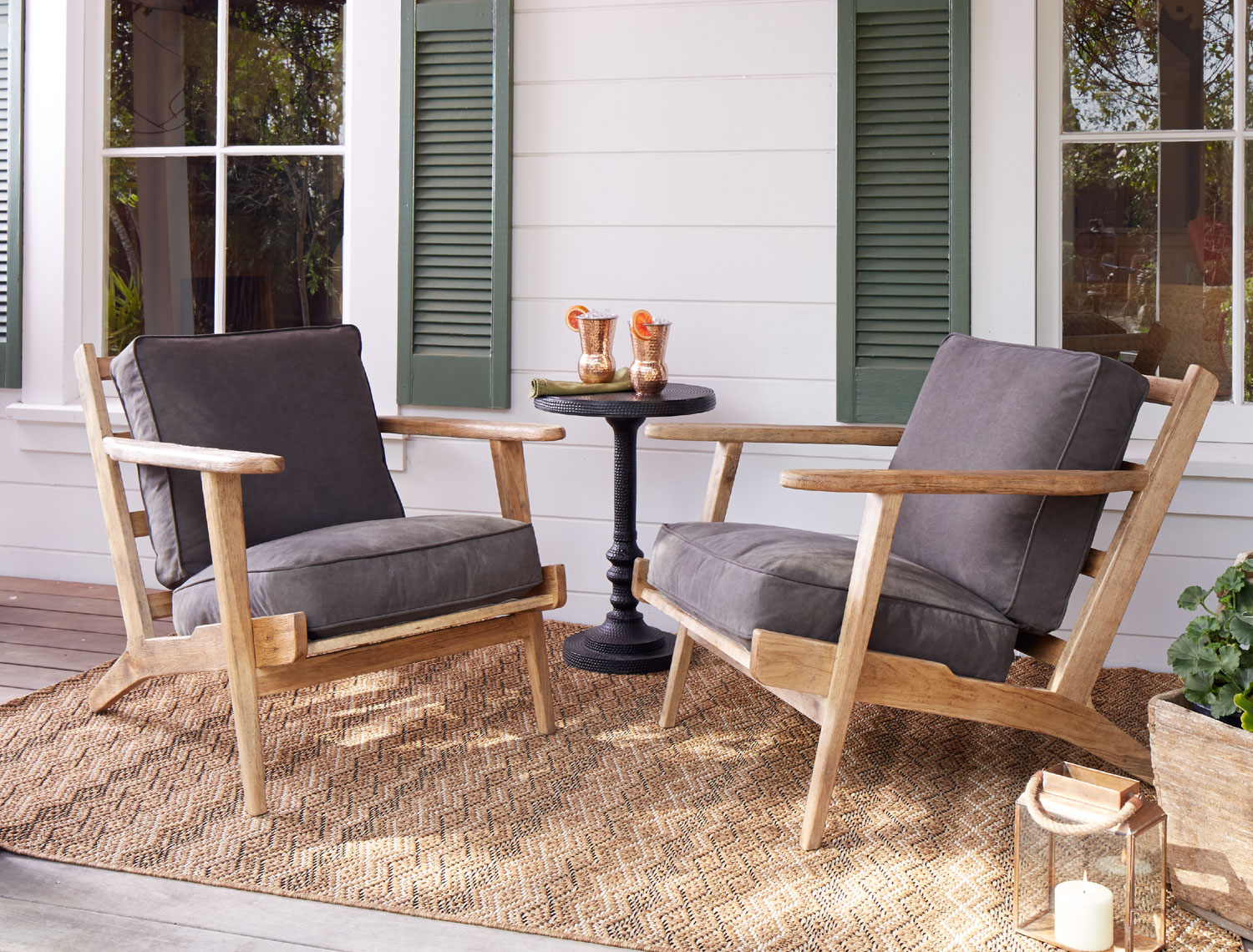Wood chairs with dark cushions on wood porch in afternoon light San Francisco lifestyle photographer