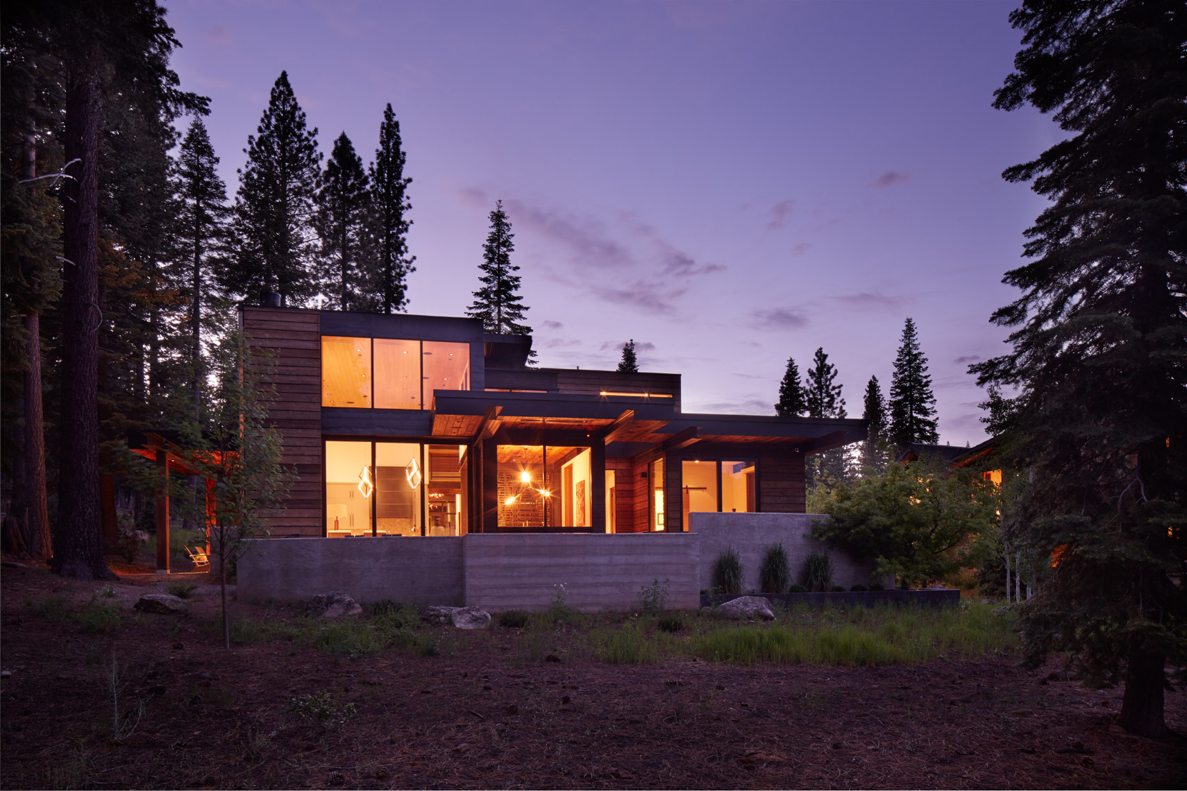 Glowing mountain home at dusk with purple sky San Francisco architectural photographer