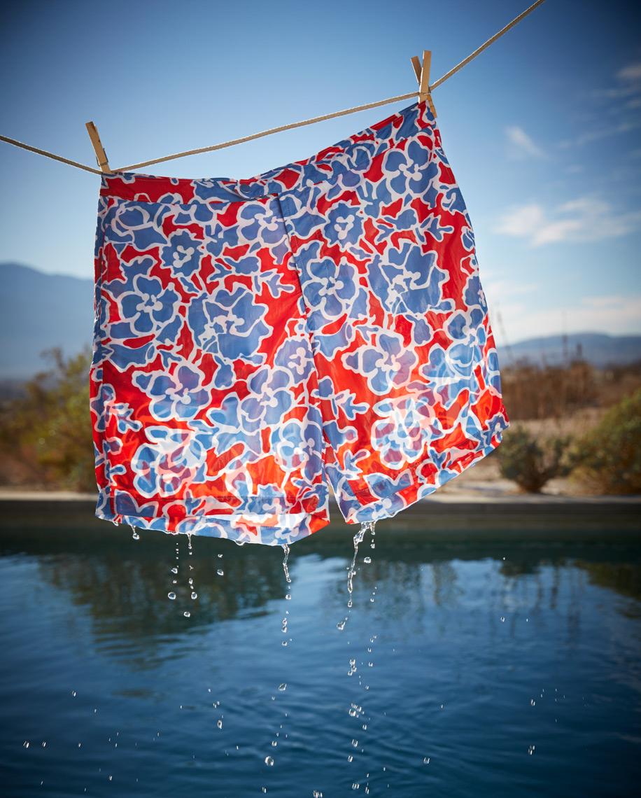 wet red floral swim shorts on clothesline dripping into serene lake San Francisco product photographer