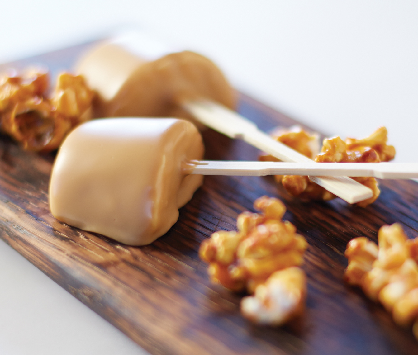 fondue-dipped cheese with caramel corn on wooden board San Francisco food photographer